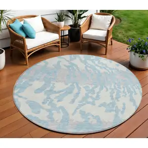Photo of 8' Sky Blue Gray And Ivory Round Animal Print Washable Indoor Outdoor Area Rug