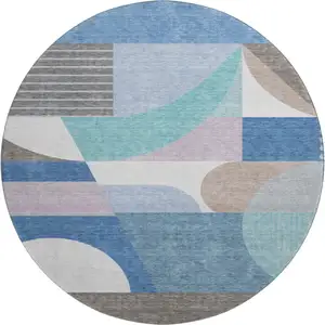 Photo of 8' Sky Blue Teal And Ivory Geometric Washable Round Rug With UV Protection