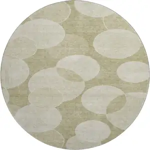 Photo of 8' Tan And Beige Geometric Washable Round Rug With UV Protection