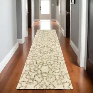 Photo of 8' Tan And Ivory Wool Geometric Hand Tufted Runner Rug