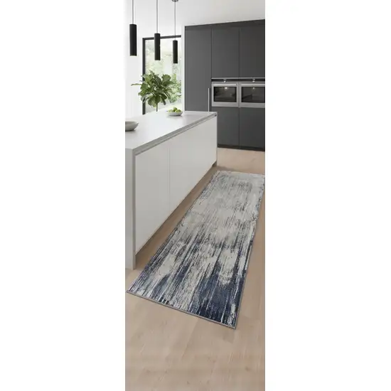 8' Tan Blue And Ivory Abstract Power Loom Distressed Runner Rug Photo 1