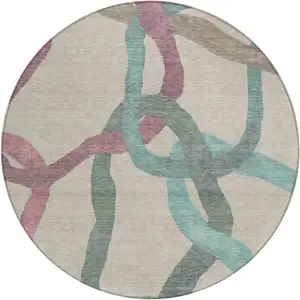 Photo of 8' Tan Blue And Mauve Round Abstract Washable Indoor Outdoor Area Rug