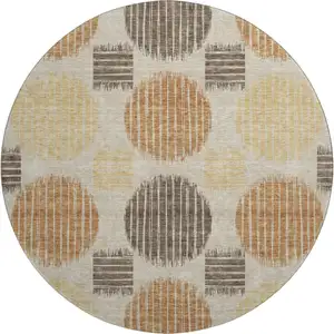 Photo of 8' Tan Gold And Brown Geometric Washable Round Rug With UV Protection