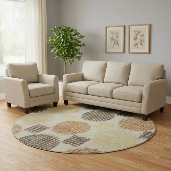 8' Tan Gold And Brown Geometric Washable Round Rug With UV Protection Photo 1