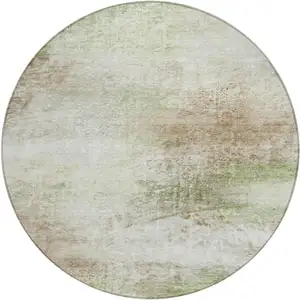 Photo of 8' Tan Green And Beige Round Abstract Washable Indoor Outdoor Area Rug