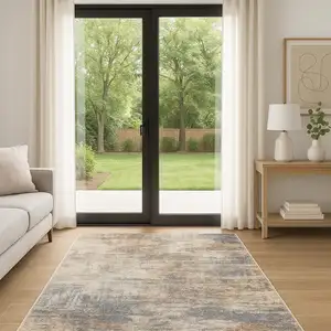 Photo of 6' Tan Ivory And Black Abstract Runner Rug