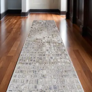 Photo of 10' Tan Ivory And Blue Geometric Power Loom Distressed Runner Rug