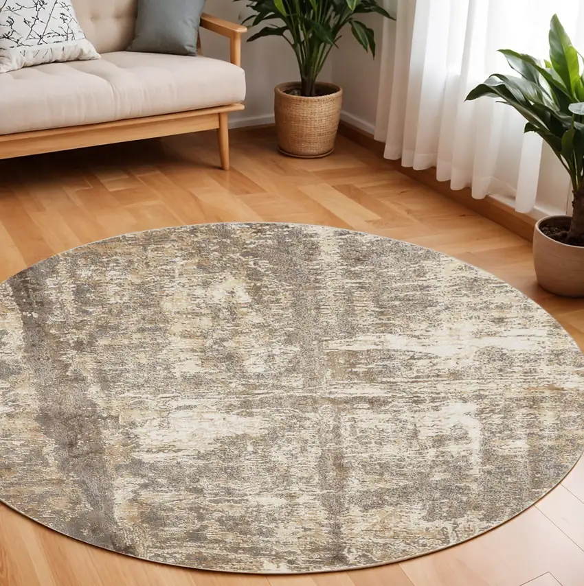 8' Tan and Ivory Abstract Non Skid Round Rug Photo 1
