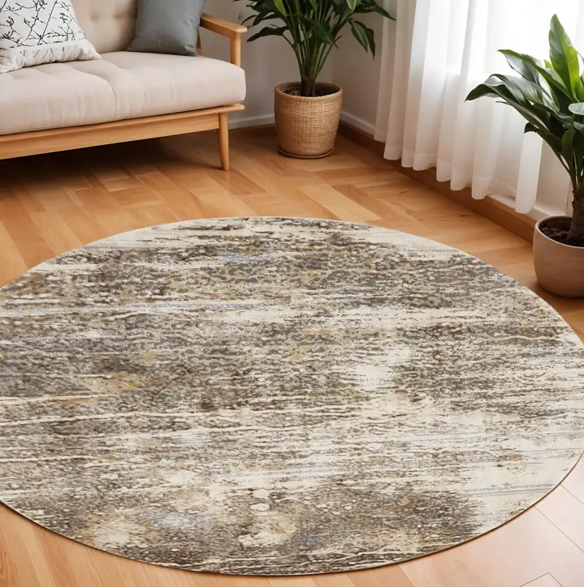 8' Tan and Ivory Abstract Non Skid Round Rug Photo 1