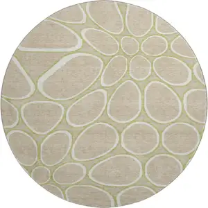 Photo of 8' Tan Ivory And Green Geometric Washable Round Rug With UV Protection