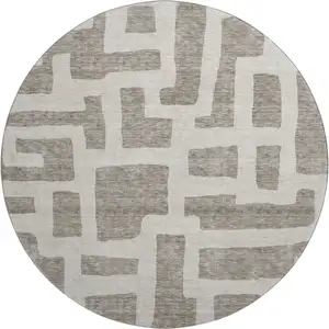 Photo of 8' Taupe And Beige Abstract Geometric Washable Round Rug With UV Protection