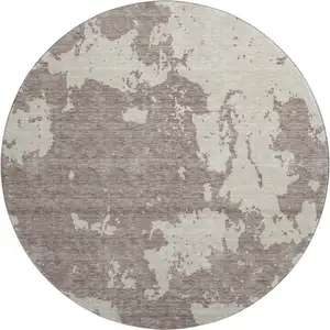 Photo of 8' Taupe And Beige Abstract Washable Round Rug With UV Protection