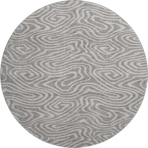 Photo of 8' Taupe And Beige Abstract Washable Round Rug With UV Protection