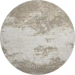Photo of 8' Taupe And Beige Abstract Washable Round Rug With UV Protection