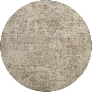 Photo of 8' Taupe And Beige Abstract Washable Round Rug With UV Protection