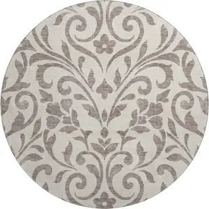 Photo of 8' Taupe And Beige Floral Washable Round Rug With UV Protection