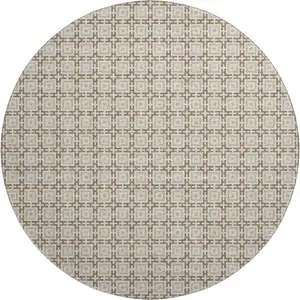 Photo of 8' Taupe And Beige Geometric Washable Round Rug With UV Protection