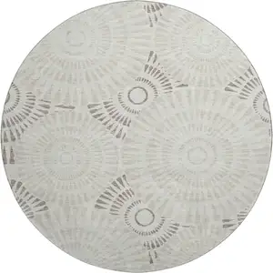 Photo of 8' Taupe And Beige Geometric Washable Round Rug With UV Protection