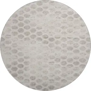 Photo of 8' Taupe And Beige Geometric Washable Round Rug With UV Protection