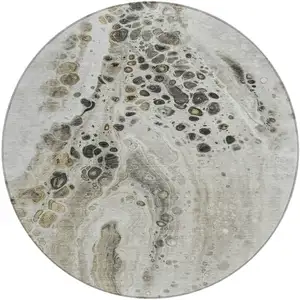 Photo of 8' Taupe And Beige Round Abstract Washable Indoor Outdoor Area Rug