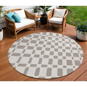Photo of 8' Taupe And Beige Round Geometric Washable Indoor Outdoor Area Rug
