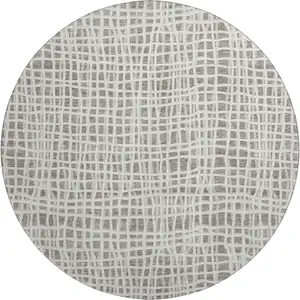 Photo of 8' Taupe And Beige Striped Washable Round Rug With UV Protection