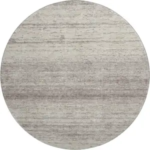 Photo of 8' Taupe And Beige Striped Washable Round Rug With UV Protection