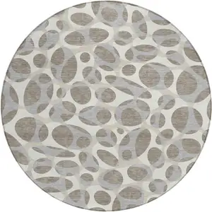 Photo of 8' Taupe And Brown Round Abstract Washable Indoor Outdoor Area Rug