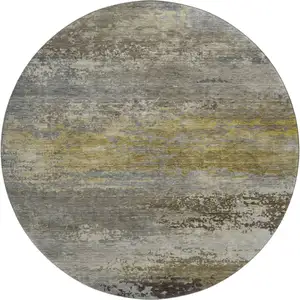 Photo of 8' Taupe And Gold Abstract Washable Round Rug With UV Protection