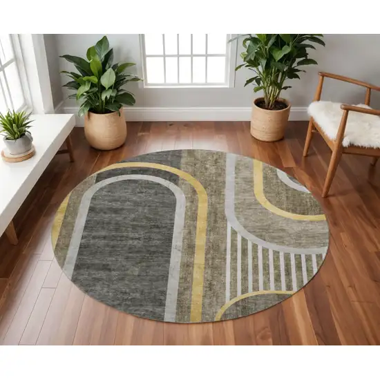 8' Taupe And Gold Geometric Washable Round Rug With UV Protection Photo 2