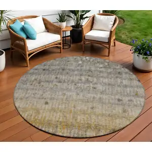 Photo of 8' Taupe And Gold Round Striped Washable Indoor Outdoor Area Rug