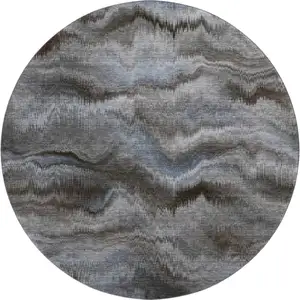 Photo of 8' Taupe And Gray Abstract Washable Round Rug With UV Protection