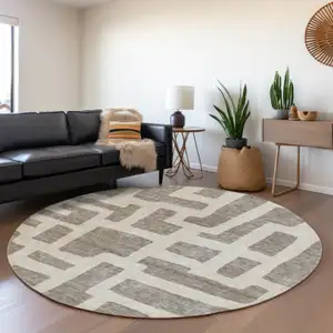 Photo of 8' Taupe And Gray Round Abstract Washable Indoor Outdoor Area Rug