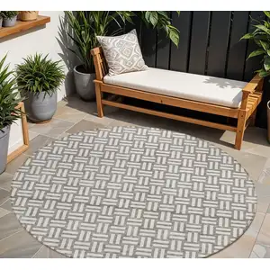 Photo of 8' Taupe And Gray Round Geometric Washable Indoor Outdoor Area Rug