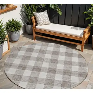 Photo of 8' Taupe And Gray Round Plaid Washable Indoor Outdoor Area Rug