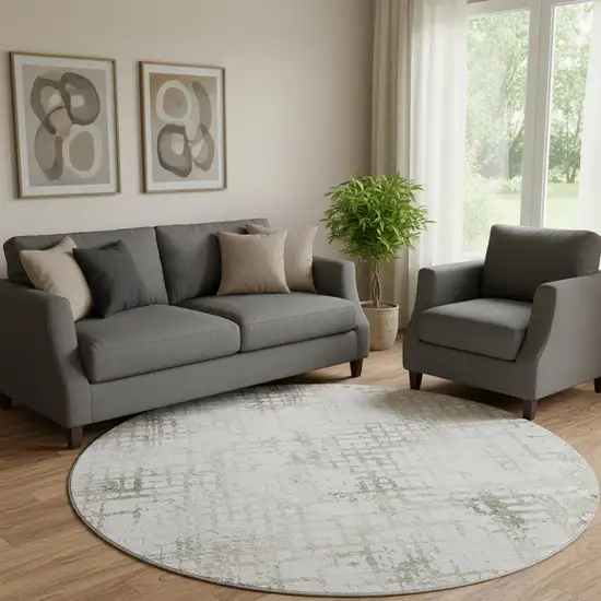 8' Taupe And Ivory Abstract Geometric Washable Round Rug With UV Protection Photo 1