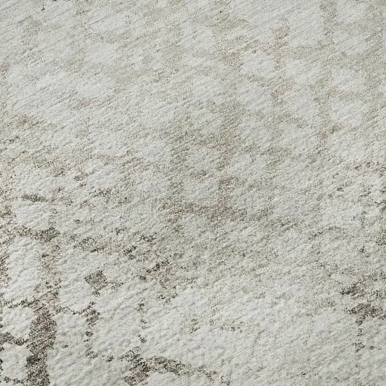 8' Taupe And Ivory Abstract Geometric Washable Round Rug With UV Protection Photo 9