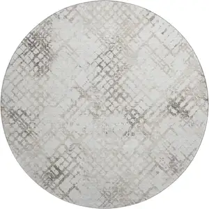 Photo of 8' Taupe And Ivory Abstract Geometric Washable Round Rug With UV Protection