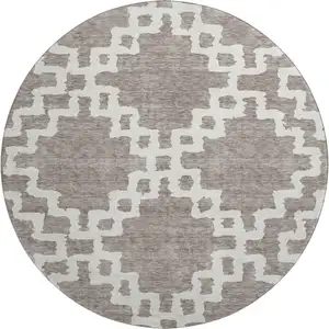 Photo of 8' Taupe And Ivory Abstract Geometric Washable Round Rug With UV Protection