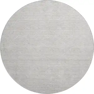 Photo of 8' Taupe And Ivory Abstract Geometric Washable Round Rug With UV Protection