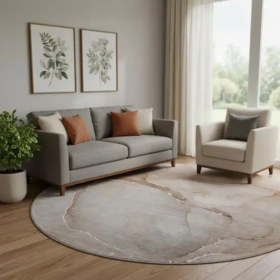 8' Taupe And Ivory Abstract Washable Round Rug With UV Protection Photo 1