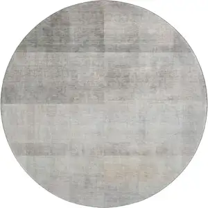 Photo of 8' Taupe And Ivory Abstract Washable Round Rug With UV Protection