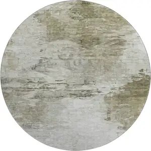 Photo of 8' Taupe And Ivory Abstract Washable Round Rug With UV Protection