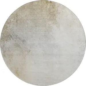 Photo of 8' Taupe And Ivory Abstract Washable Round Rug With UV Protection