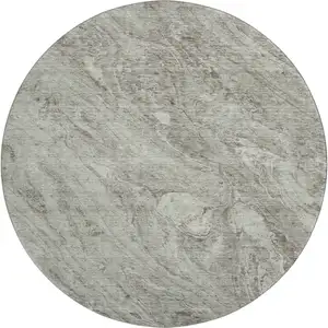 Photo of 8' Taupe And Ivory Abstract Washable Round Rug With UV Protection