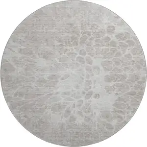 Photo of 8' Taupe And Ivory Abstract Washable Round Rug With UV Protection