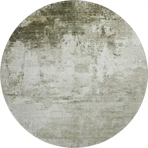 Photo of 8' Taupe And Ivory Abstract Washable Round Rug With UV Protection