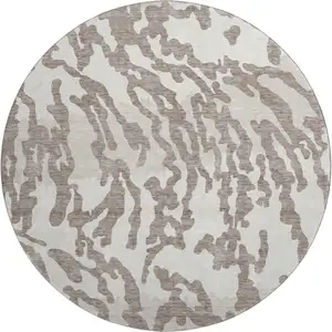 Photo of 8' Taupe And Ivory Animal Print Washable Round Rug With UV Protection