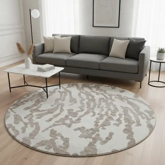 8' Taupe And Ivory Animal Print Washable Round Rug With UV Protection Photo 2