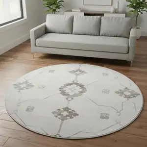 Photo of 8' Taupe And Ivory Floral Medallion Washable Round Rug With UV Protection